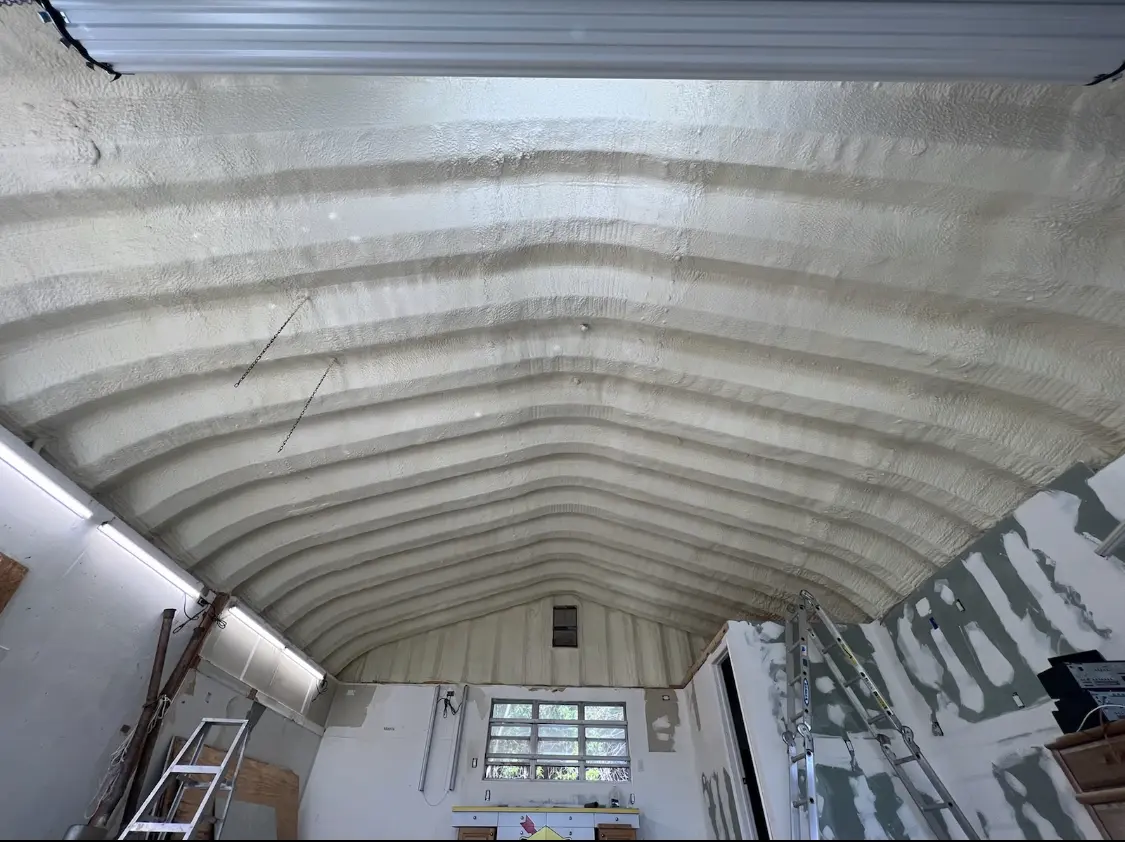 Spray polyurethane foam applied to the underside of a metal roof deck in Halfway